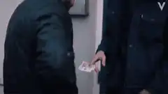Man hands money to another man