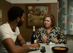 Man tells woman to drink and they toast