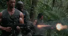Soldiers firing machine guns in jungle