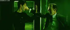 Agent Smith punches Neo