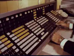 Operator using vintage telephone switchboard