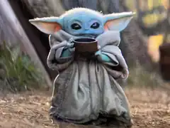 Baby Yoda holding a cup
