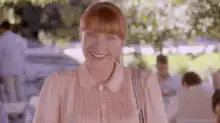 Becky Sharp smiles at her phone