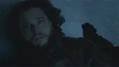 Jon Snow lying in snow