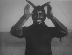 Man in bunny ears smiling