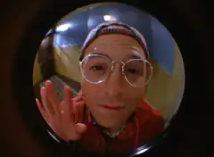 Stifler looking through peephole
