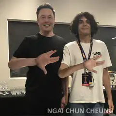 Elon Musk and fan waving