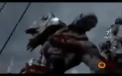 Kratos fighting a large enemy in the rain