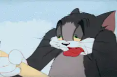 Tom licking his lips