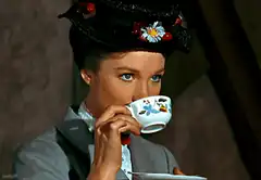 Mary Poppins sipping tea