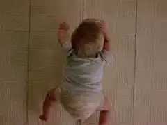Baby looking up from floor