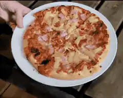 Pizza slides off plate