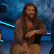 Jason Momoa nodding and smiling