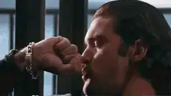 Man punches glass and shatters it