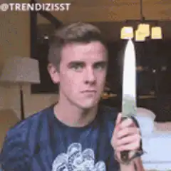 Man licking knife and getting shocked
