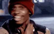Terry Crews smiling and touching his neck