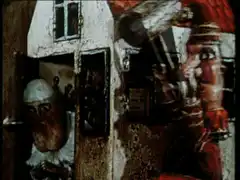 Puppet house with red monster