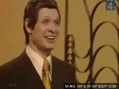 Man in suit laughing hysterically