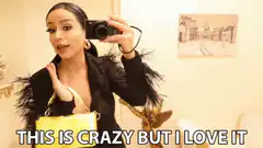 Woman filming herself with camera and yellow bag