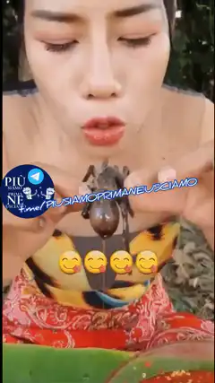Woman eating a large tarantula
