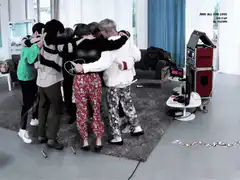 BTS group hug in living room