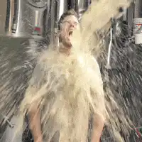 man getting blasted by beer