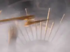 Golden God Zeus holding lightning bolt