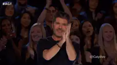 Simon Cowell clapping with audience