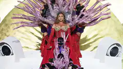 Beyoncé in red gown with pink tentacle wings