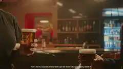 Two people clinking beer glasses cheers to that