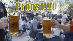 Two people clinking beer mugs outdoors
