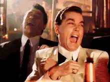 Leonardo DiCaprio laughing with Bitcoin laser eyes