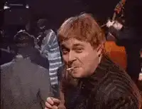 Elton John smoking and saying nice
