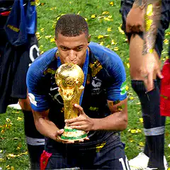 Kylian Mbappe kisses World Cup trophy