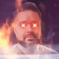 Man with glowing eyes and fire