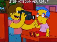 Ned Flanders taking picture of Ralph Wiggum