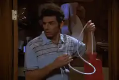 George Costanza with a red rubber bulb