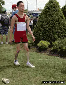 Man in red singlet dramatically faints