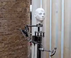 Robot head with hammer arm