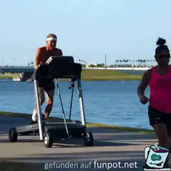 Man running on motorized treadmill outdoors