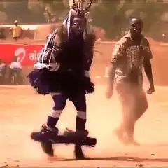 Dancer on stilts kicks up dust