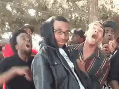 Guy screaming with hands on face