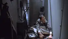 Man in suit looking at open briefcase
