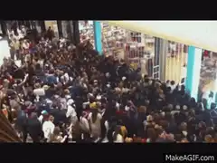 Crowd rushing into a store