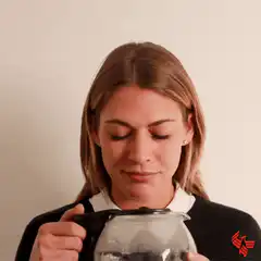 Woman drinking coffee from carafe