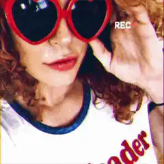 Woman with heart sunglasses and light streaks
