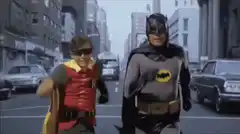 Batman and Robin running down the street