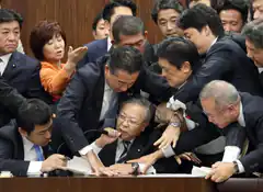 Japanese politicians arguing at a table