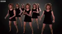 Men in dresses and wigs dancing