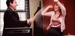 Michael Scott sprays Pam with a water gun